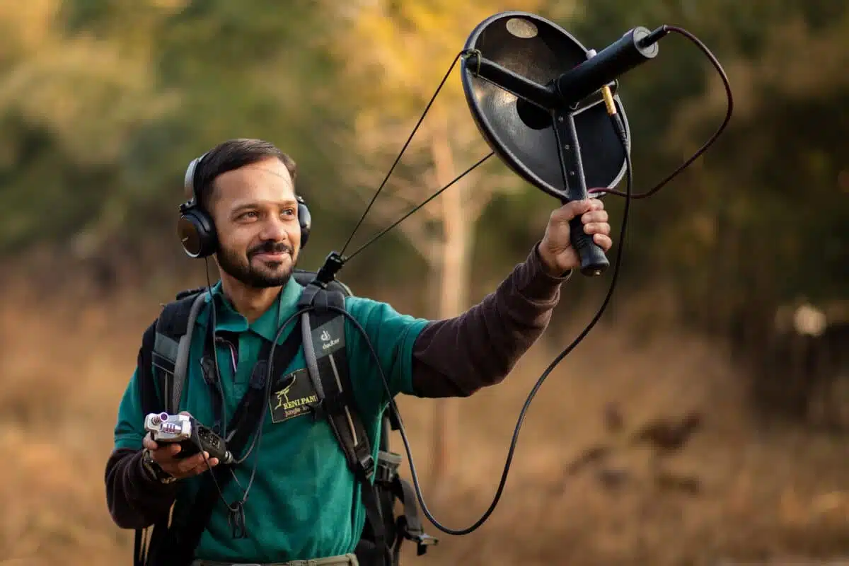 A scientist records animal sounds.